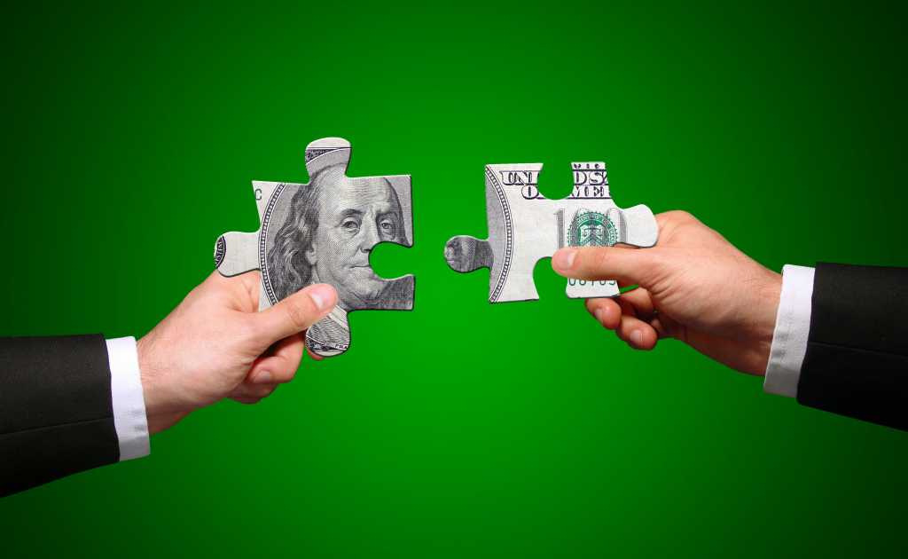 Financial teamwork money benjamin puzzle pieces fit solve