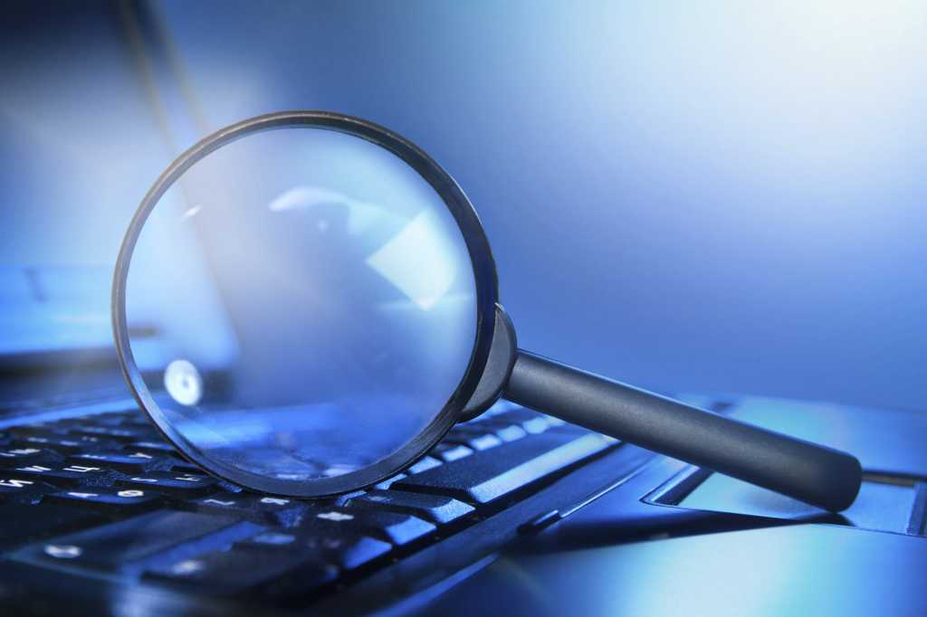 Magnifying loupe on the laptop keyboard    147860345