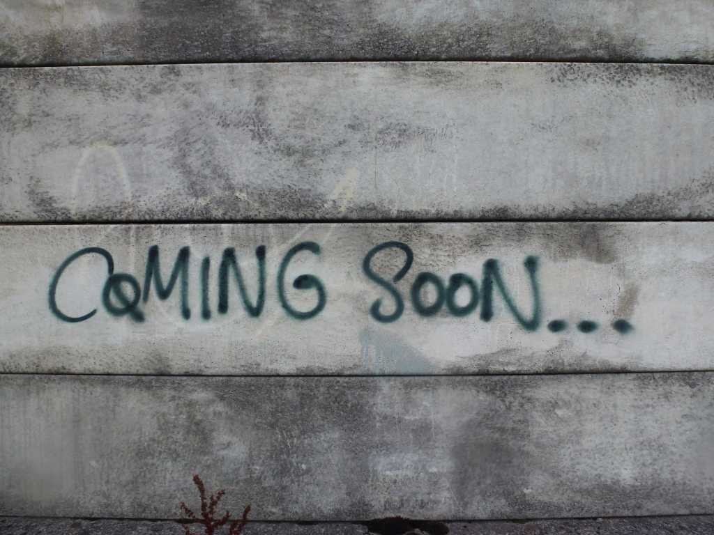 coming soon sign grafitti