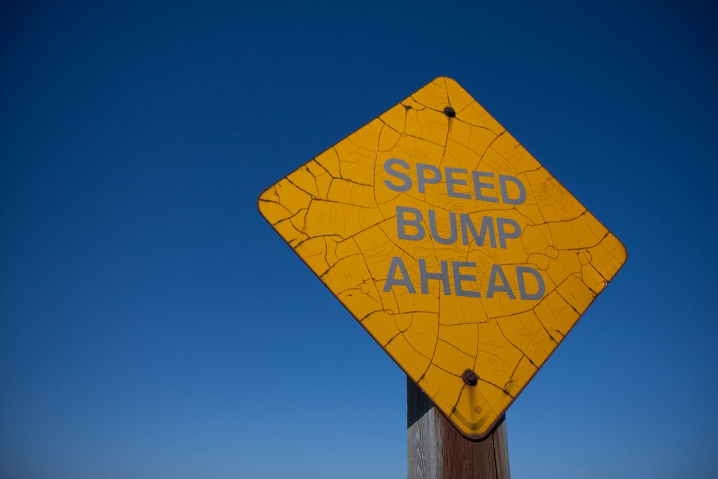 speed bump ahead sign