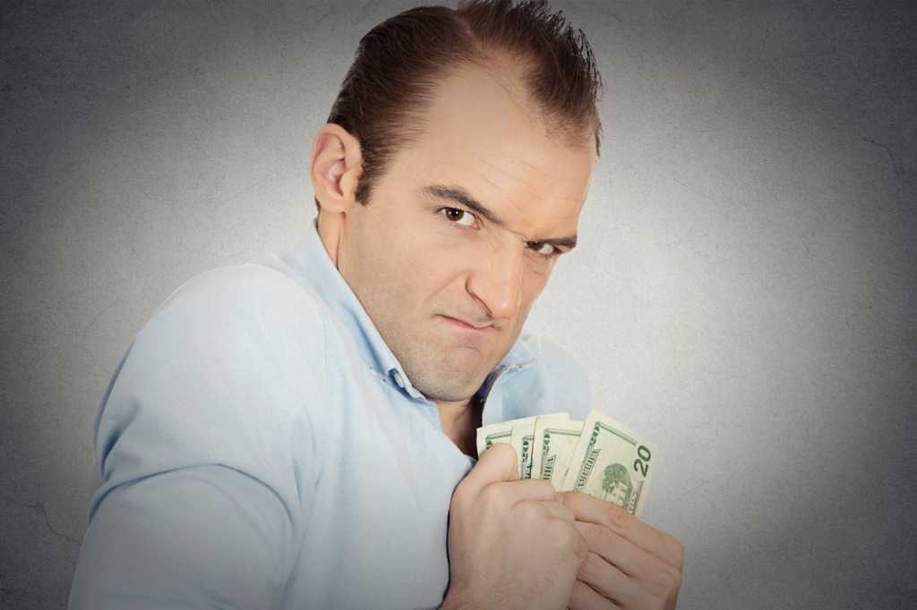 3 do you share credit stingy selfish man holding pile of money cash