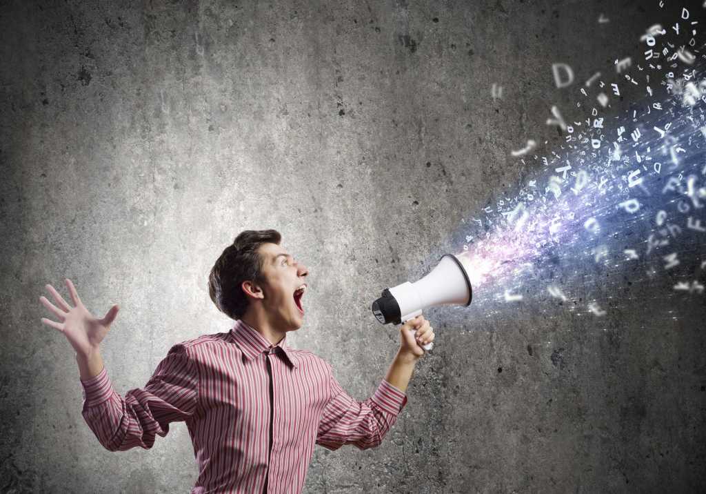 Man yelling screaming with data streaming out of megaphone