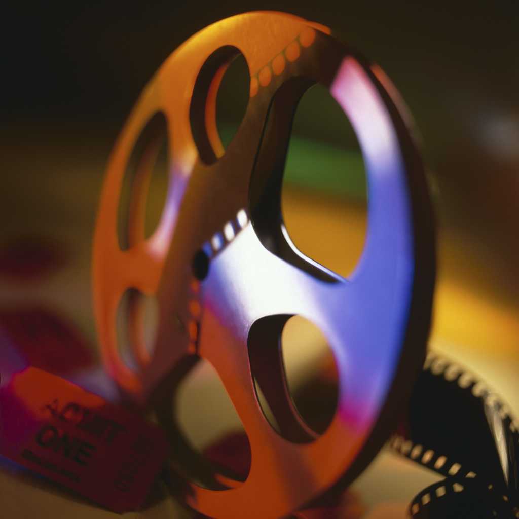 Film reel with movie ticket    87483259