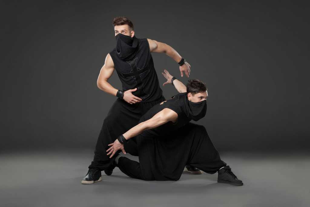 bigstock two male dancers posing in nin 136185341