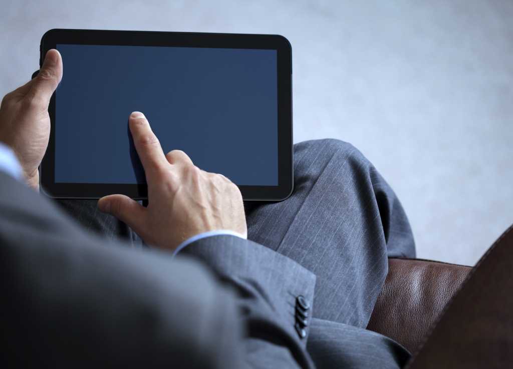 business man working on digital tablet 153986794