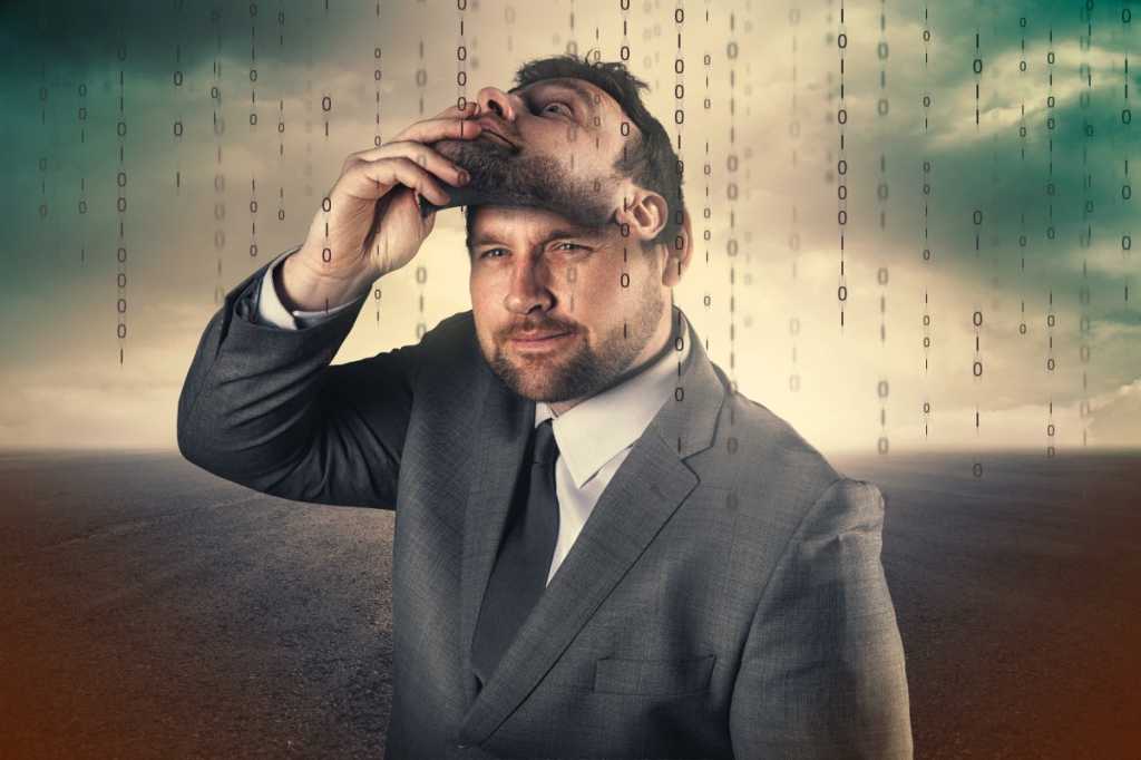 CSO slideshow - Insider Security Breaches - Two-faced businessman removes his mask in a binary world