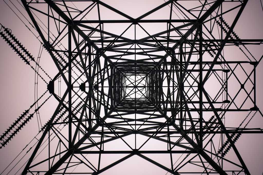 Pylon > electrical tower structure presents a networking pattern in lines of connection