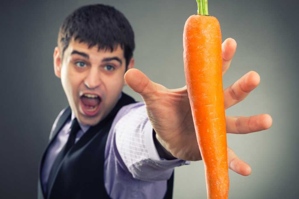 man reach for carrot salary benefits perks temptation