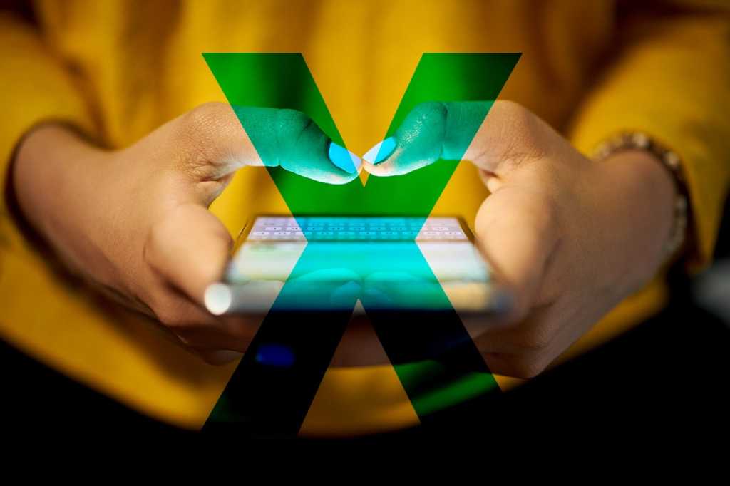 Close-up shot of a mobile user's hands and phone with a large 'X' across the image.