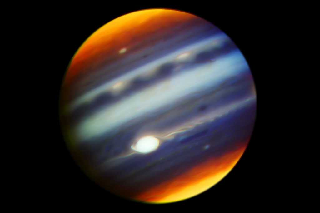 Composite, infrared image of Jupiter's Great Red Spot and haze particles over a range of altitudes.