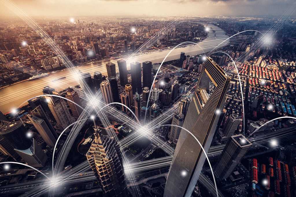 network communication connections depicted in an aerial view of a city at night