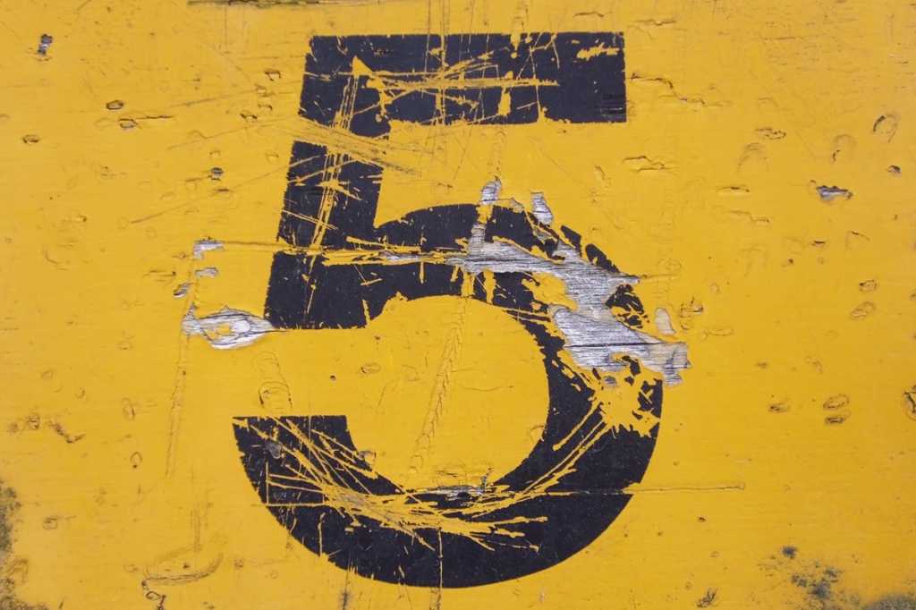 number 5 on yellow grunge background top five