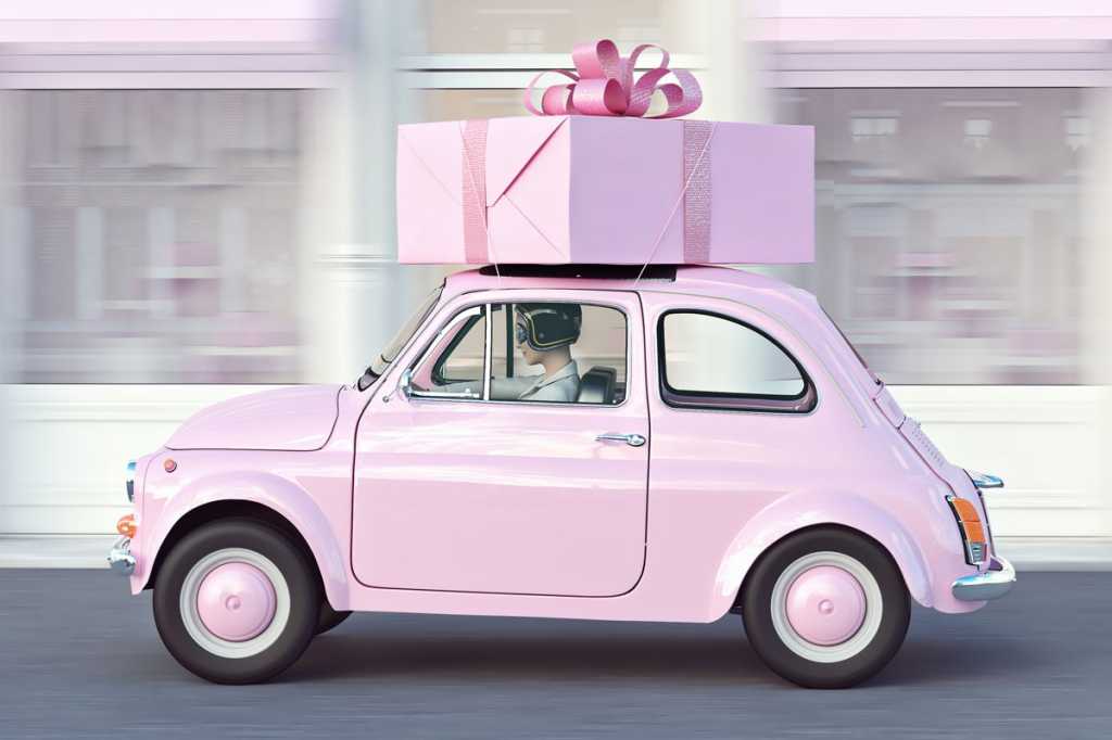 pink car with pink gift strapped to top retro euro car speed driving motion
