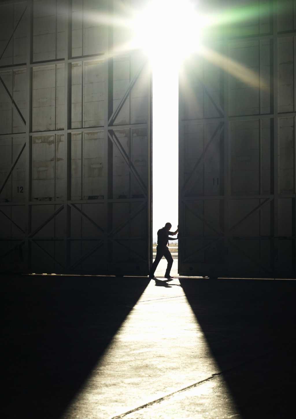 pushing open doors breakt through light idea