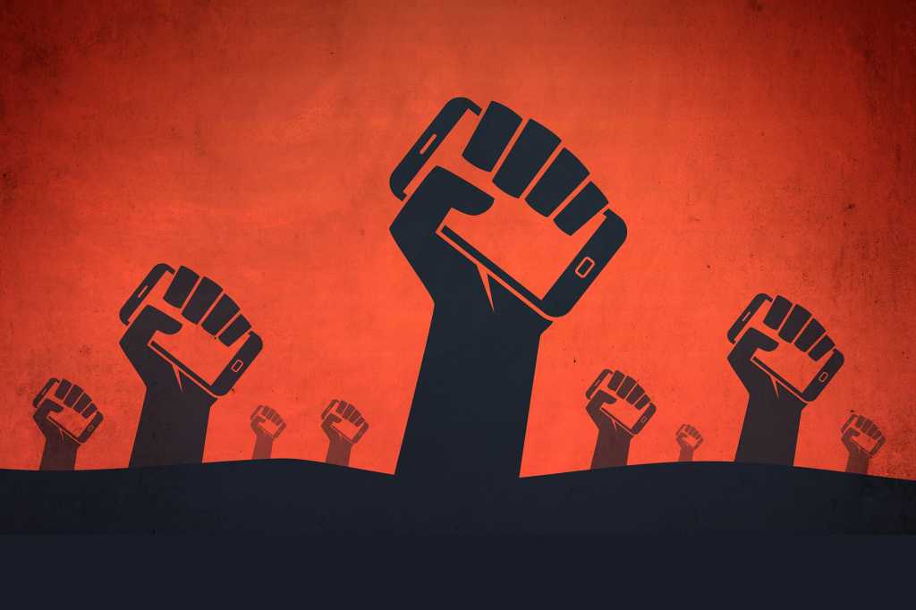 Illustration: Raised fists clutch mobile phones. [digital revolution / protest]