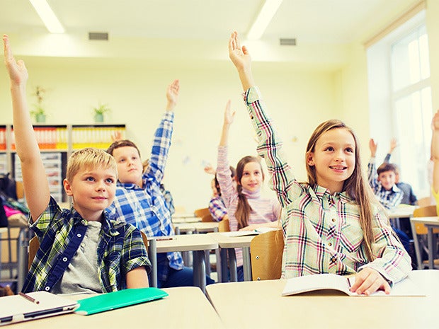 school kids rasing hands