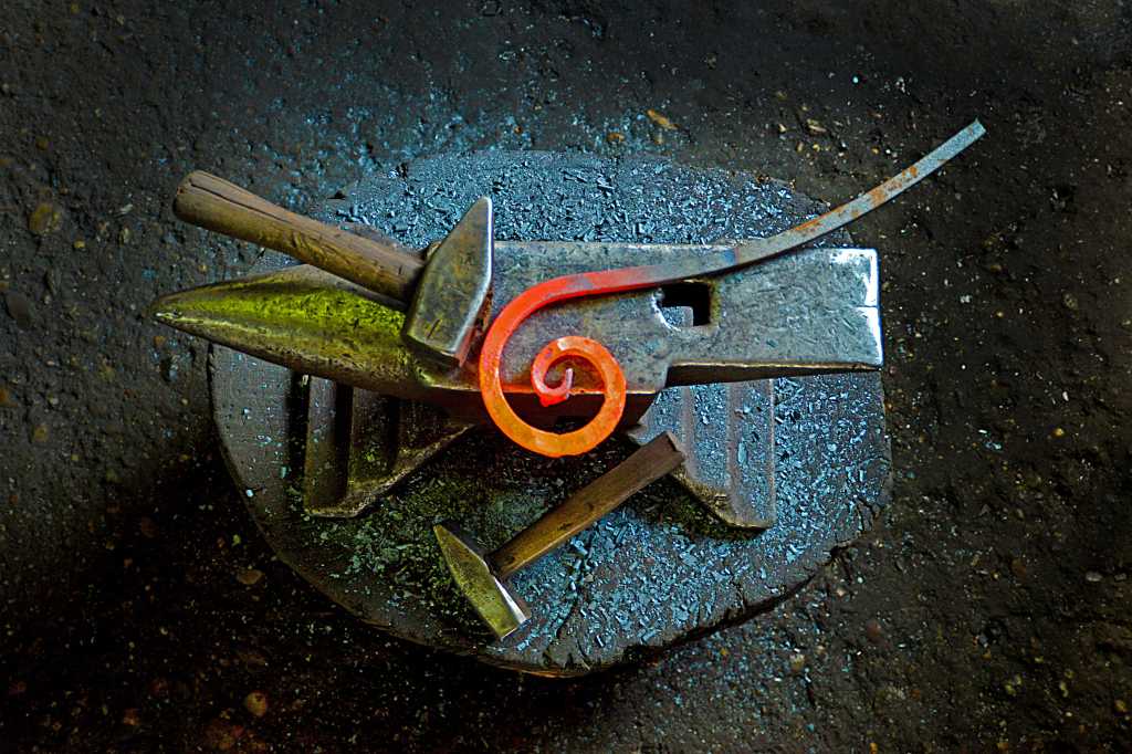 LangSmith. Blacksmith; forging; metal object on an anvil.