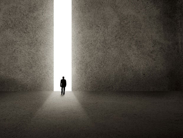 door opening light passage man walking through