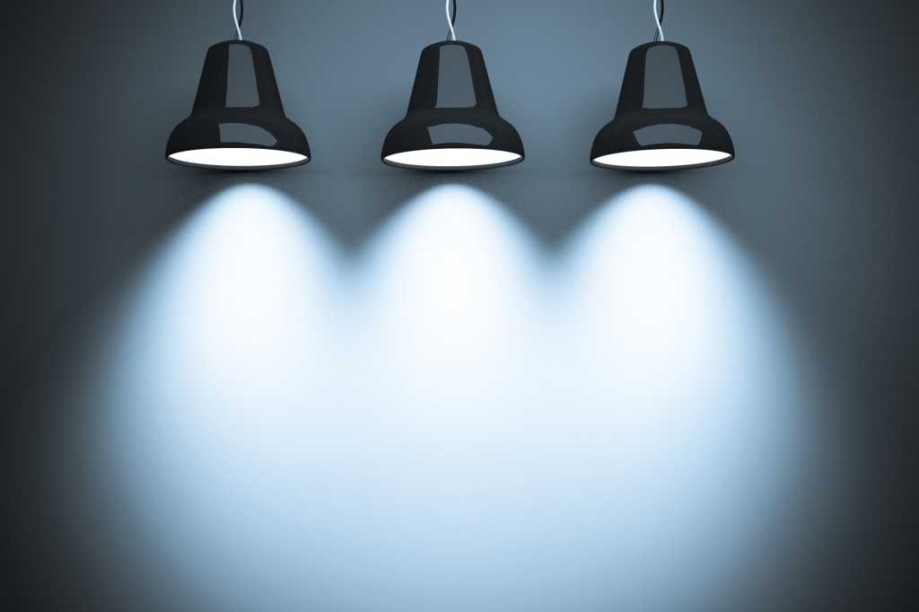 three spotlights casting lights on wall for text