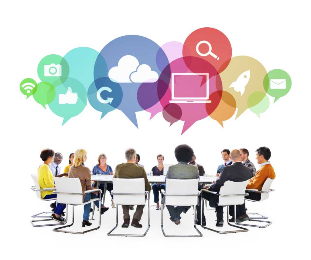 diverse group of people seated in a circle collaborating with social media icons floating above them