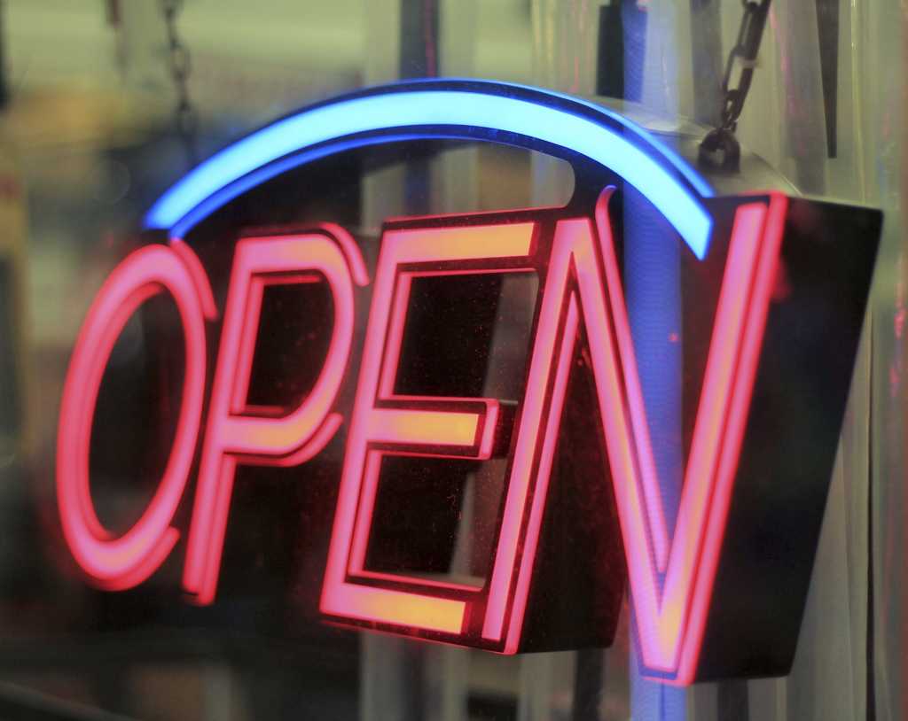 Neon Open sign on glass storefront