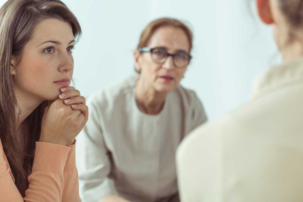 mentor senior person listening to conversation