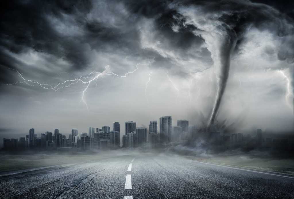 skyline with stormy sky and tornado funnel