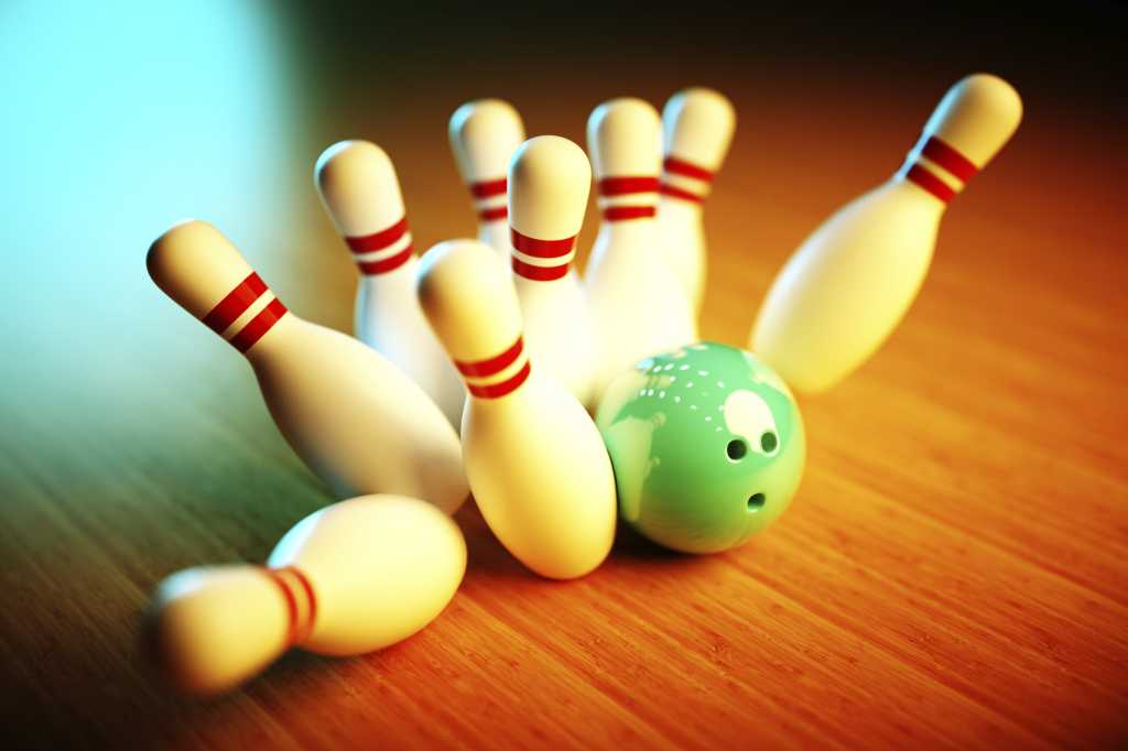 artsy still life of bowling pins with green bowling ball