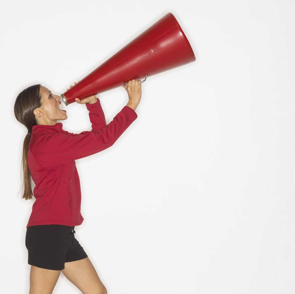 woman yelling into megaphone
