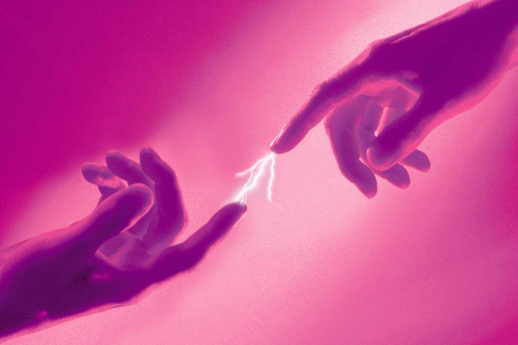 Two hands reaching and creating a spark of electricity