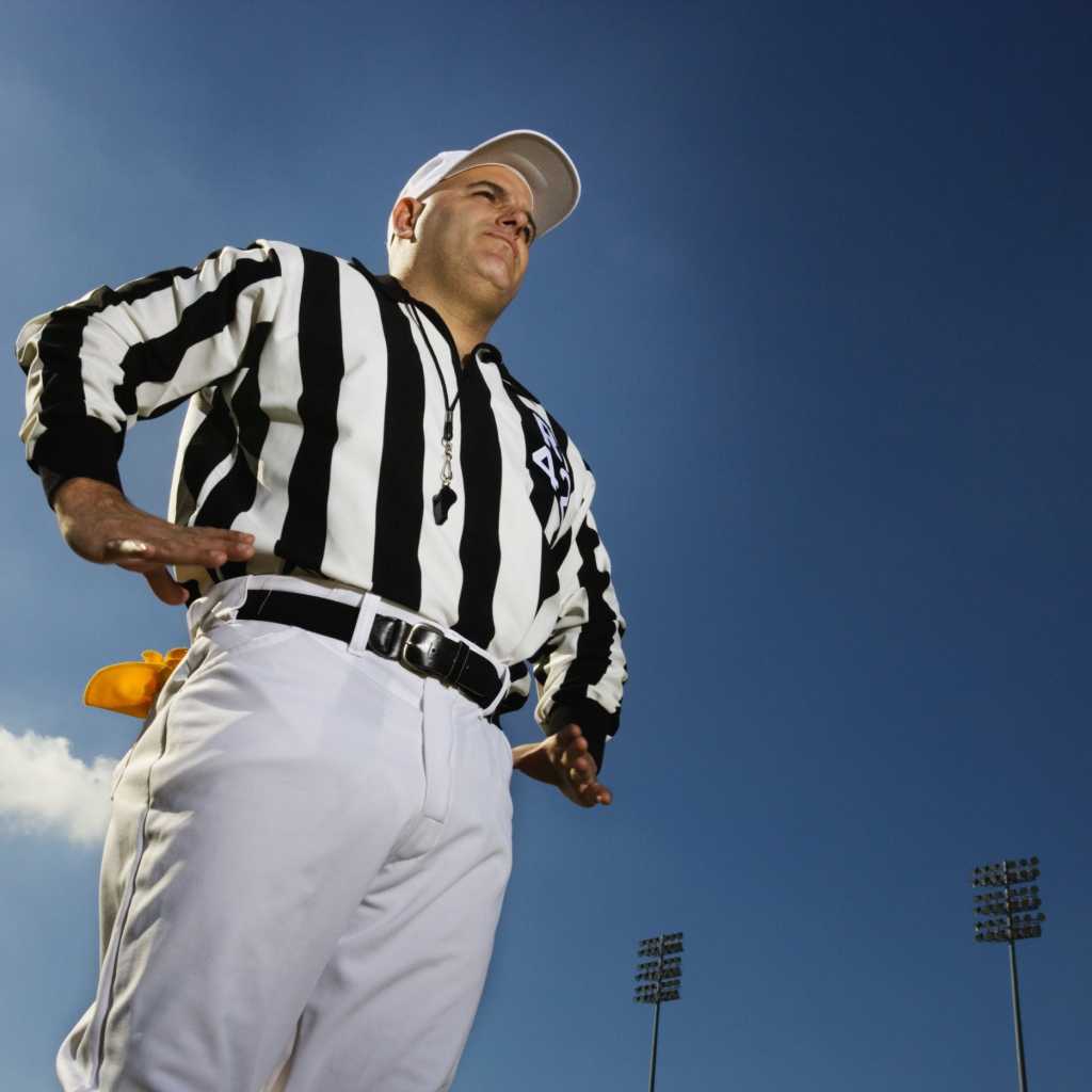 Referee shot from below on football field