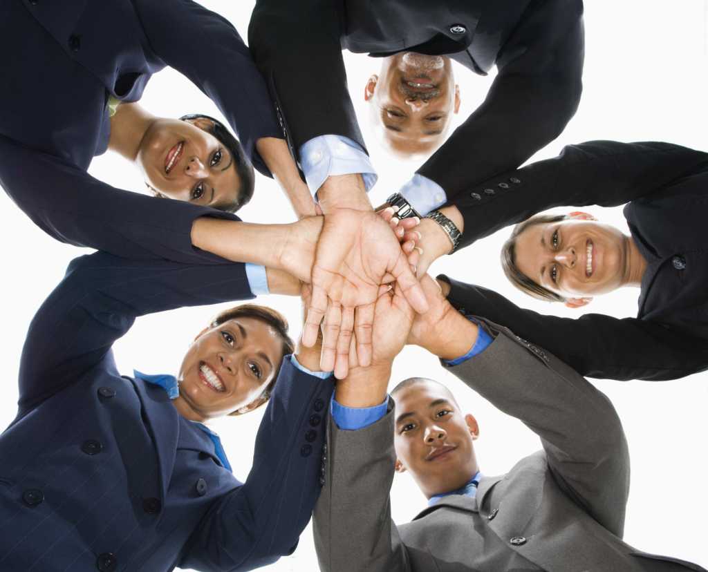 Group of people shot from below in a team formation