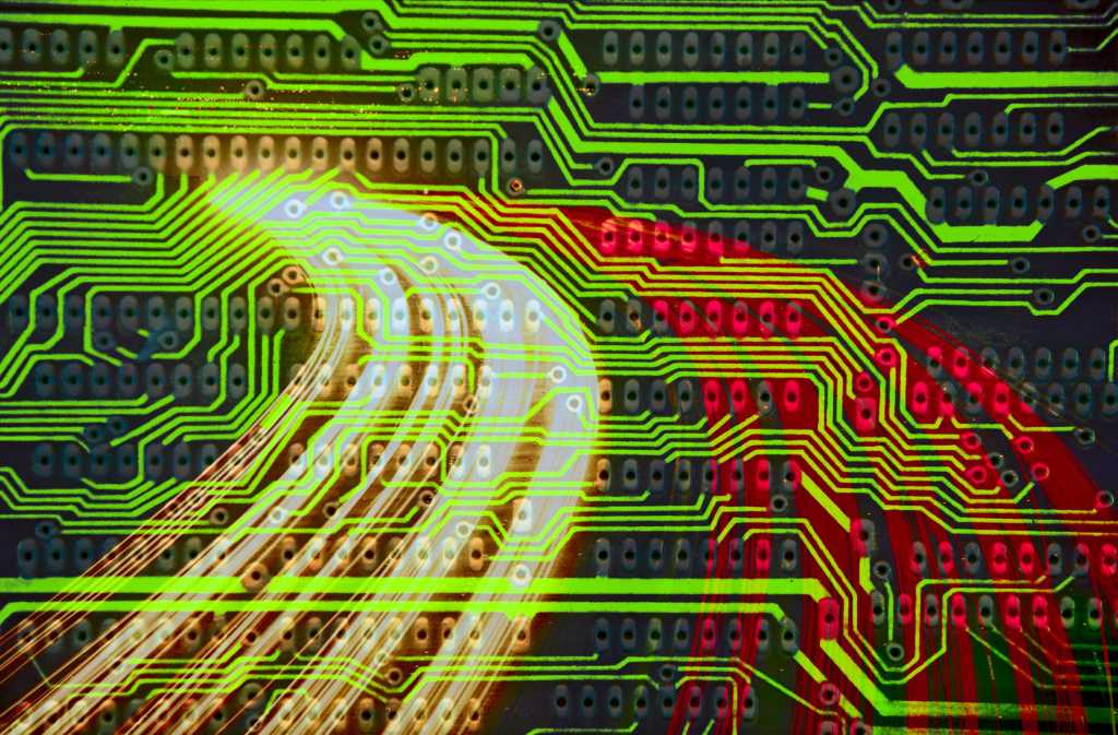 abstract traffic and circuitry background in red and green