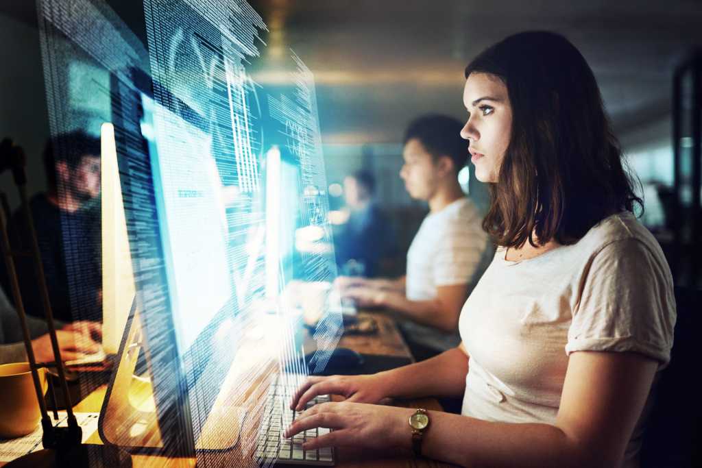 woman code program monitor screen team