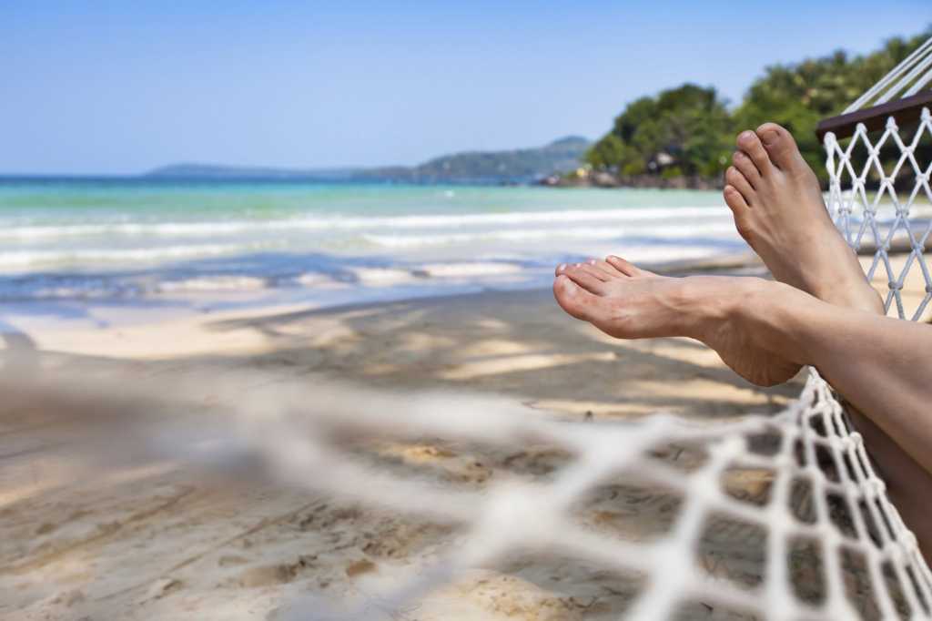 Person in hammock on the beach