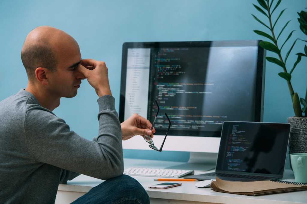 worried tired programmer developer