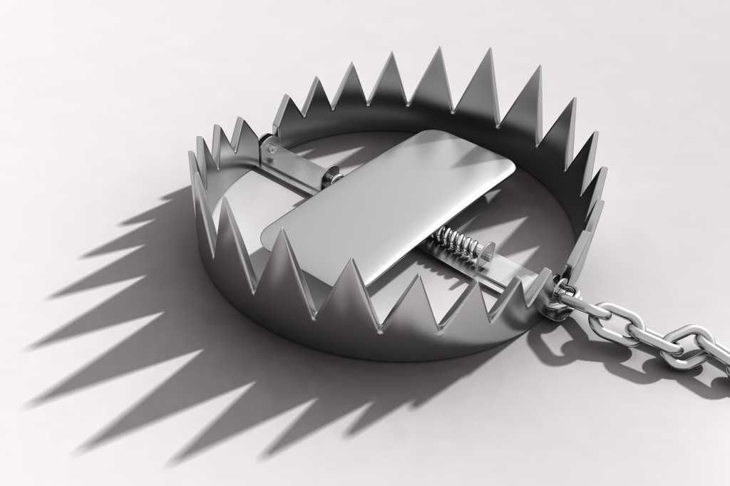 The open jaws of a spring trap lie in wait. [danger / risk]