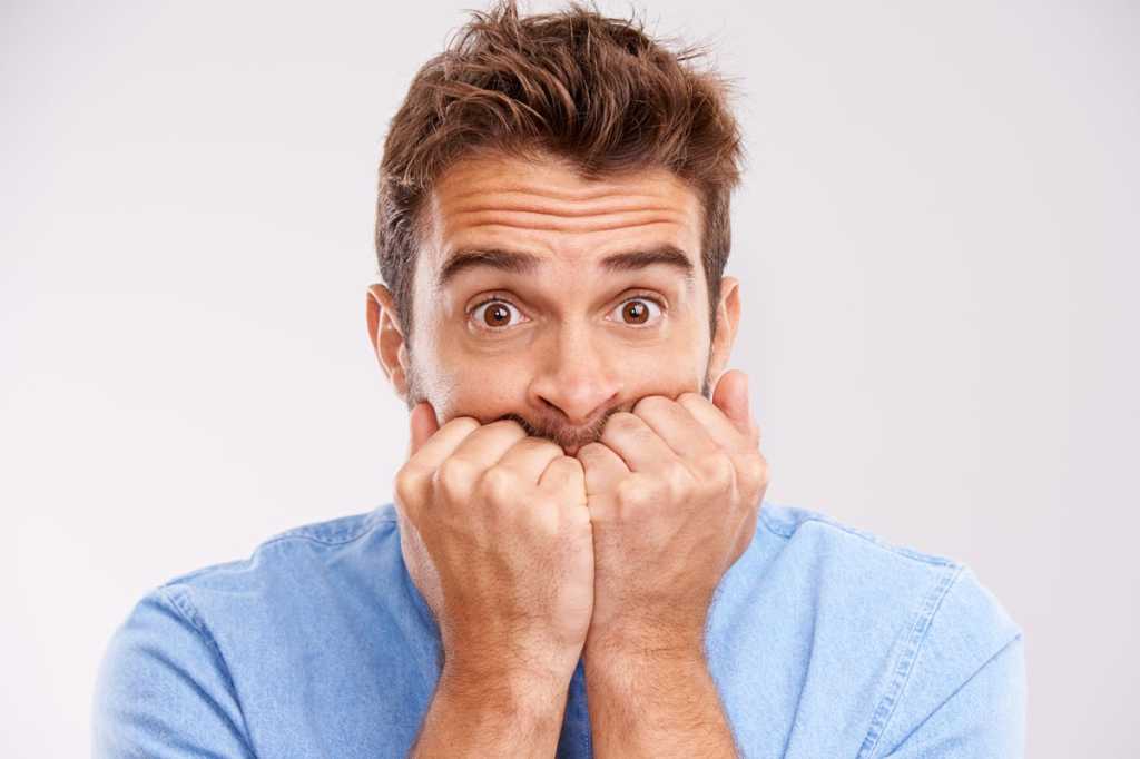 worried man with hands on face scared nervous fearful