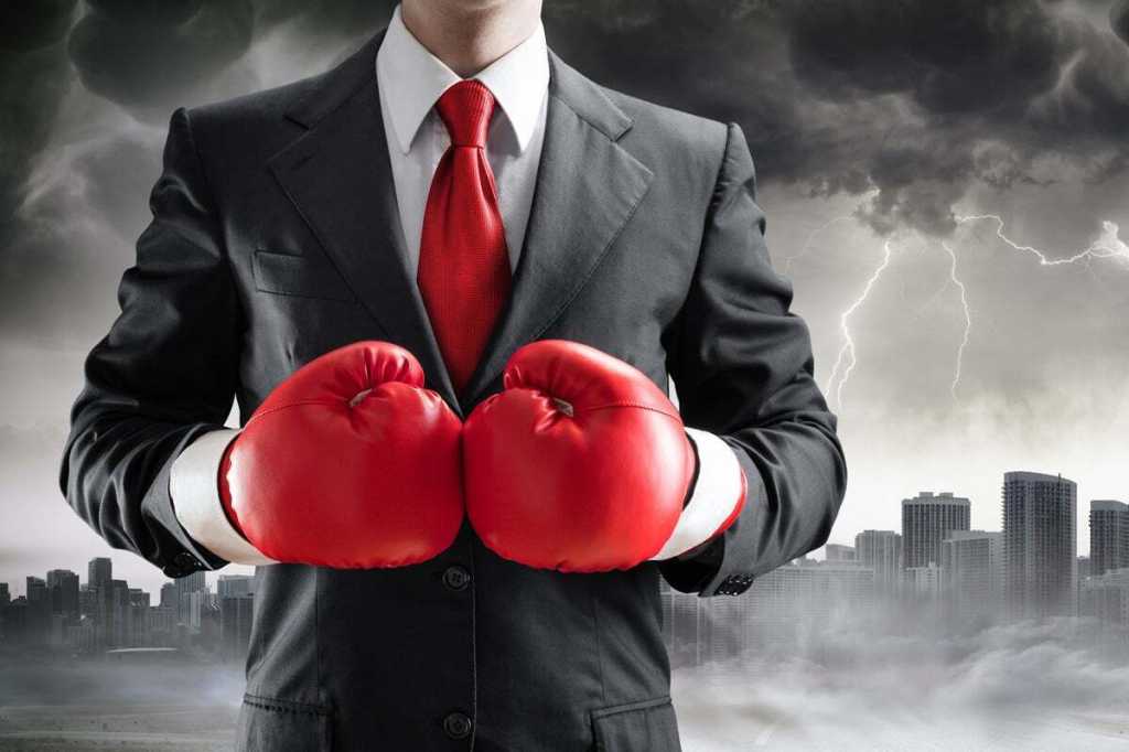 executive with boxing gloves battle competition fighter