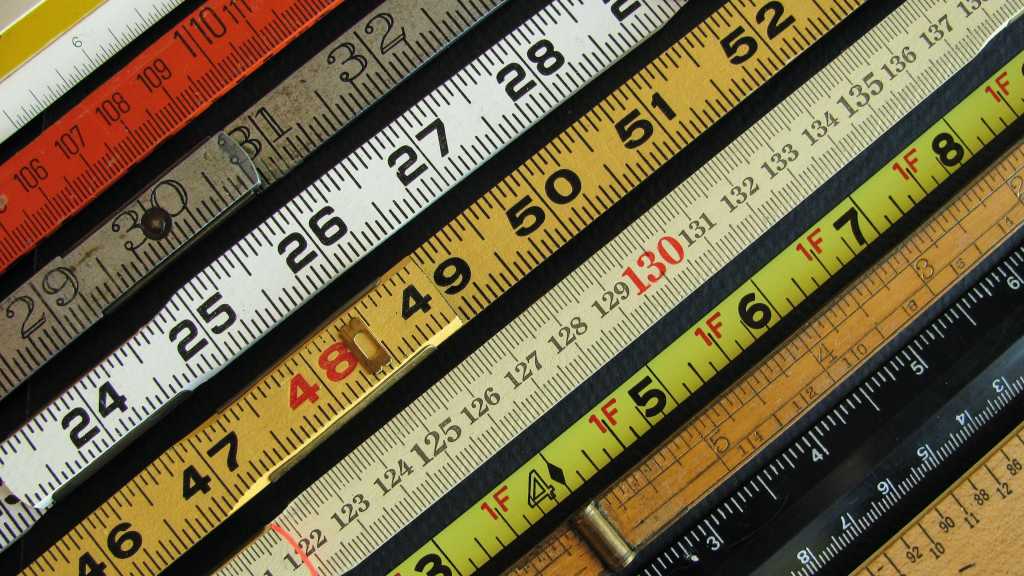 rulers measures measuring sticks of different colors placed side by side