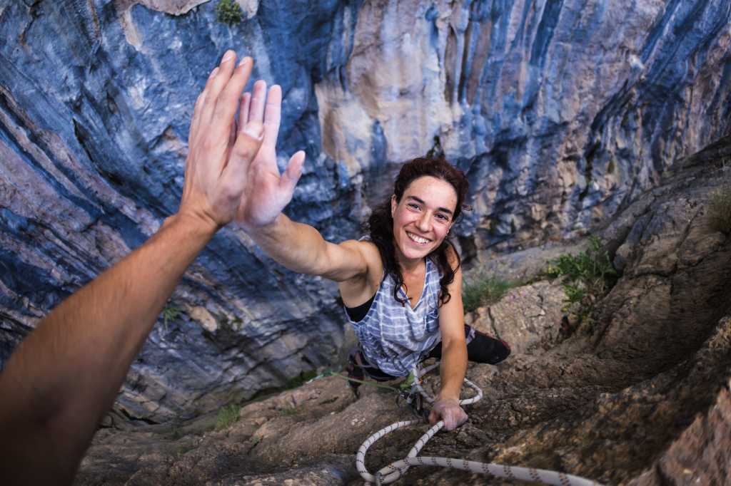 high five success winning overcome shutterstock 1768538663