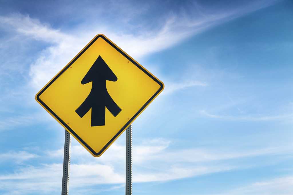Merge, merger; road sign with blue-sky background