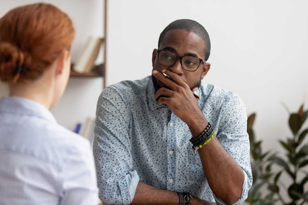 Doubtful unconvinced hr manager talking to applicant at job interview 1368244226 feeling skeptic rejecting seeker skill, bad first impression, lack of experience or failed performance