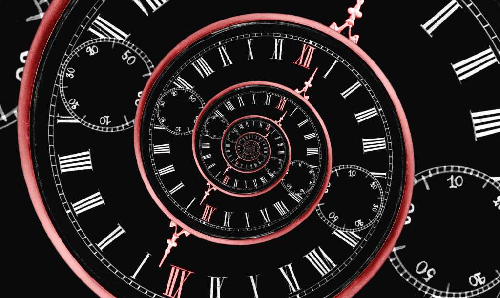 Reversed infinity time spiral; a digital image of a stopwatch with a black background and red spiral representing infinity backward.